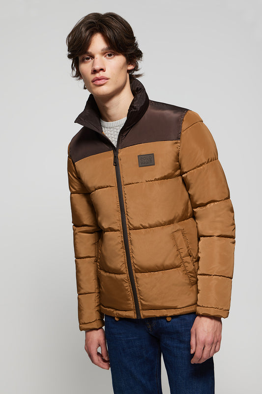 Brown puffer jacket with high collar and logo patch