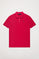 Fuchsia pique polo shirt with three-button placket and contrast embroidered logo