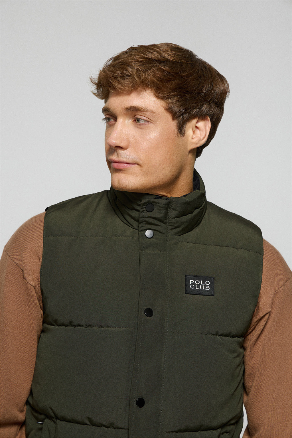 Green puffer vest with Polo Club rubber patch