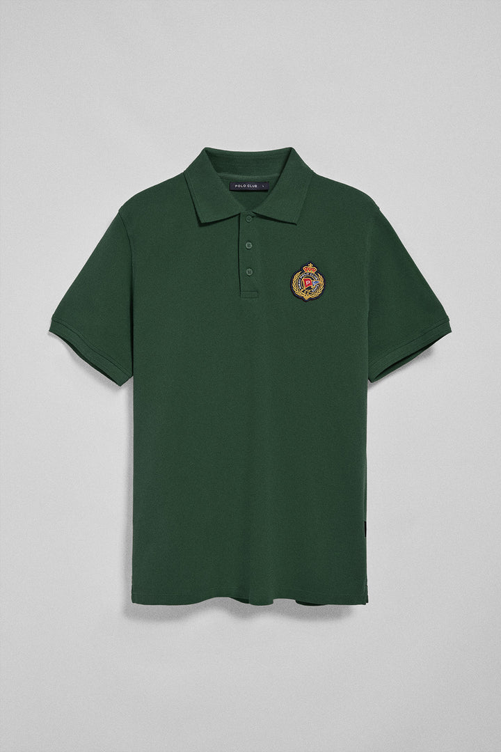Polo Nautic verde com pormenor de emblema náutico no peito