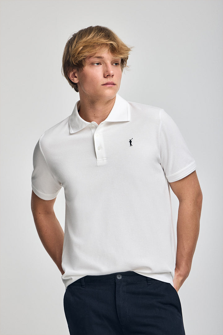White short-sleeve polo shirt with three buttons and Rigby Go embroidered logo