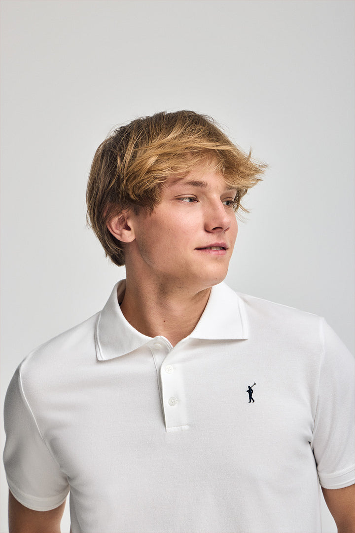 White short-sleeve polo shirt with three buttons and Rigby Go embroidered logo