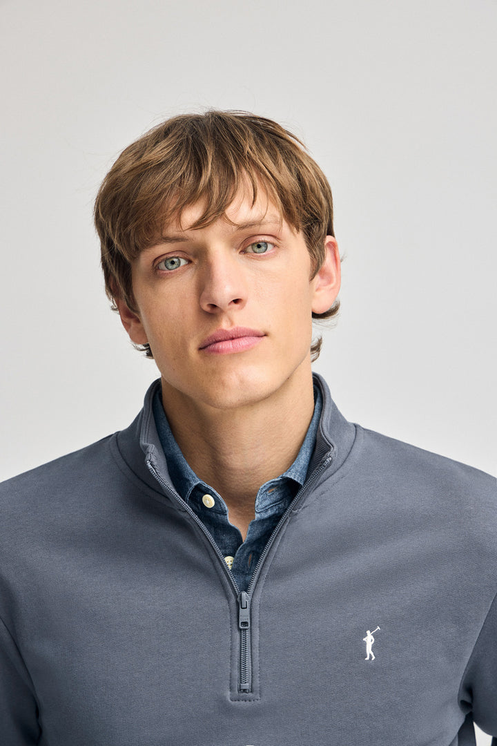Denim-blue half-zip sweatshirt with Rigby Go embroidery