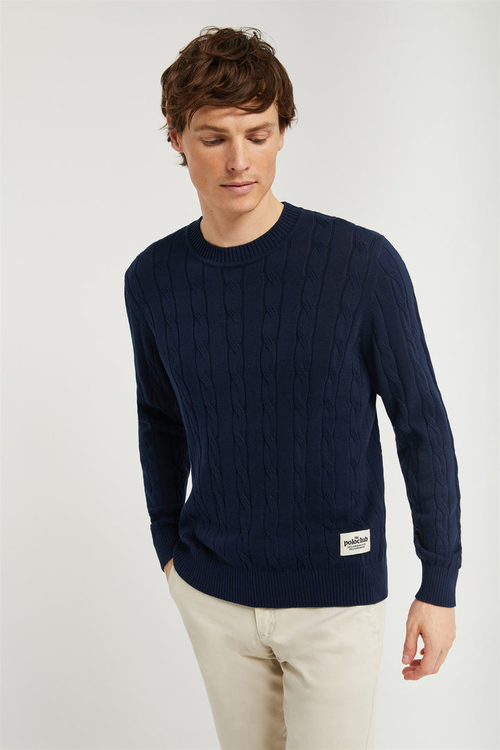 Jersey azul marino en punto de ochos con detalle en bajo