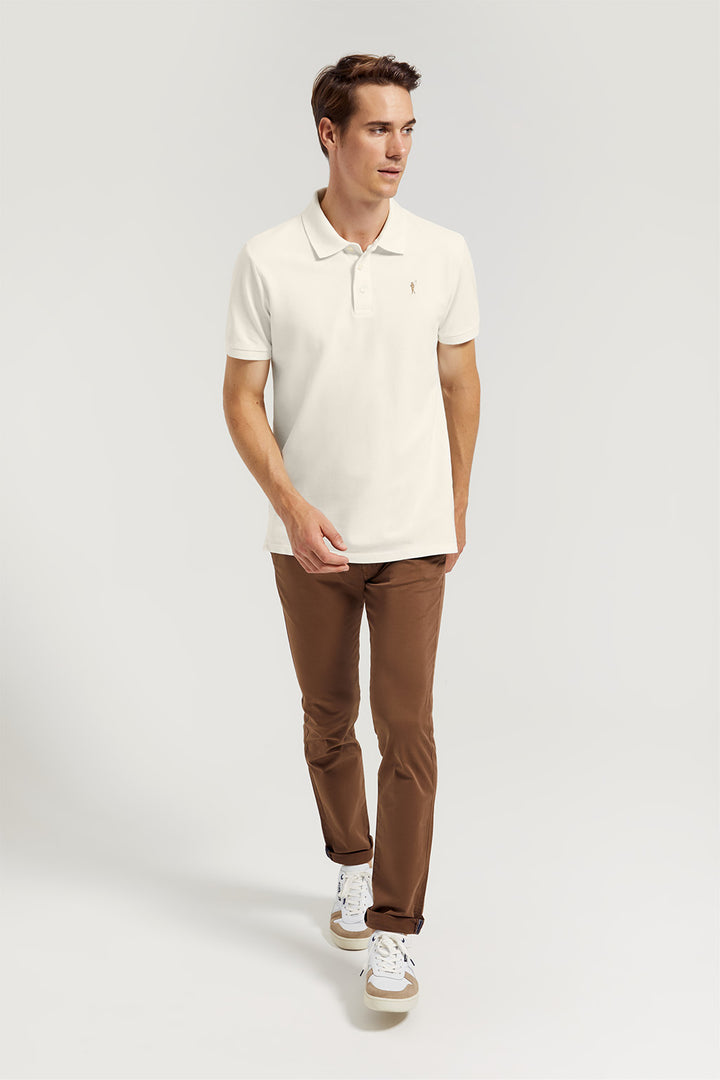 Beige pique polo shirt with three-button placket and contrast embroidered logo