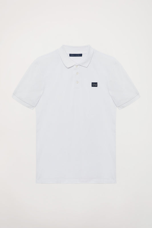 Polo blanco piqué con tapeta de tres botones y detalle Polo Club