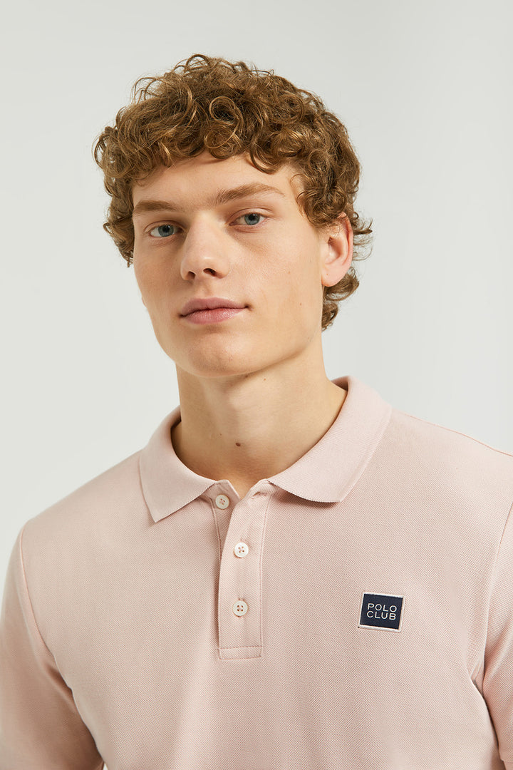 Blush-pink polo shirt with three-button placket and Polo Club detail