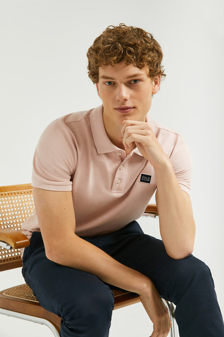 Blush-pink polo shirt with three-button placket and Polo Club detail