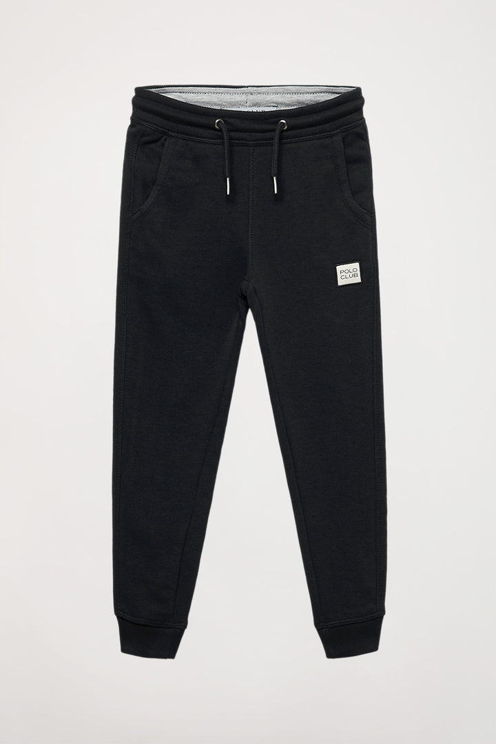 Pantalón jogger orgánico negro Neutrals kids con logo