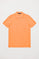 Peach pique polo shirt with three-button placket and contrast embroidered logo